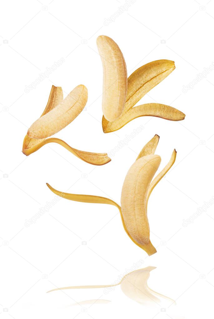Fresh ripe baby bananas falling in the air isolated on white background. Food levitation concept. High resolution image