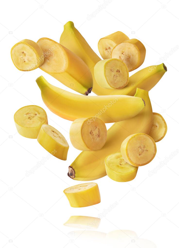 Fresh ripe baby bananas falling in the air isolated on white background. Food levitation concept. High resolution image