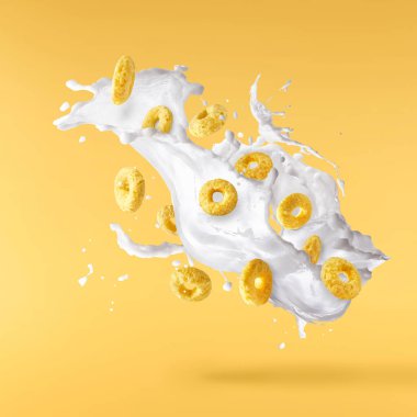 Süt damlaları havada uçuşan leziz halka gevrekleri. Gıda havalanma gebeliği. Yüksek ewsolution resmi