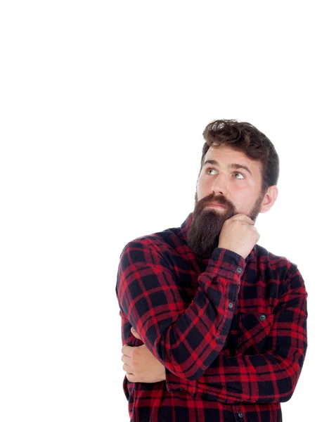 Nadenkend knappe man met lange baard — Stockfoto