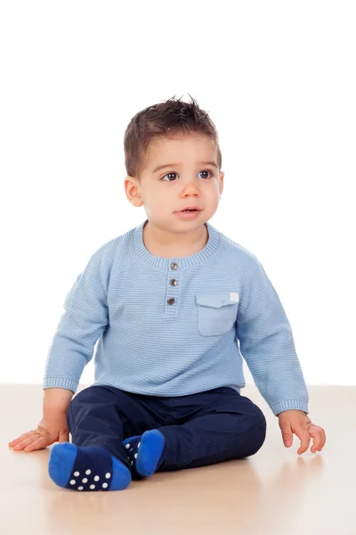 Adorable baby boy sitting on the floor — Stock Photo, Image