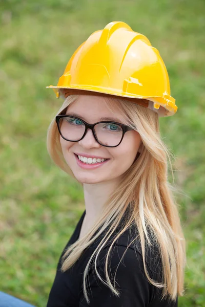 Architect woman with yellow helmet and glasses — Stock Photo, Image