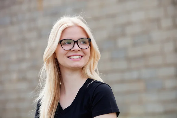 Blonde girl with glasses smiling — Stock Photo, Image