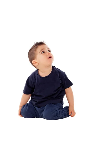 Adorable boy sitting on floor — Stock Photo, Image