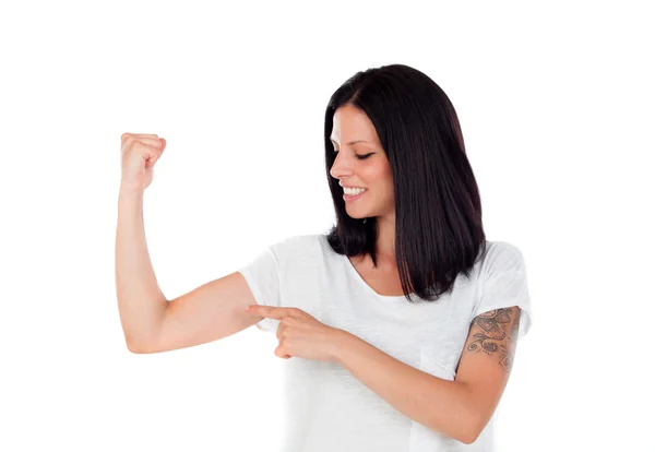 Mulher morena legal apontando seu bíceps — Fotografia de Stock