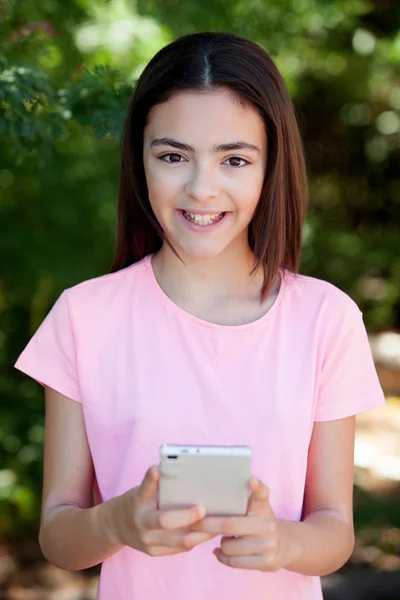 Adorable preteen girl with mobile — Stock Photo, Image
