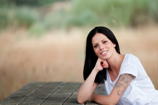 Relaxed cool girl in a beautiful park — Stock Photo, Image