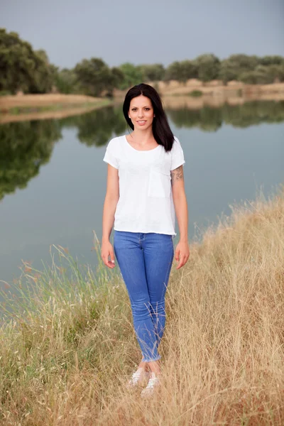 Relaxed cool girl in a beautiful park — Stock Photo, Image