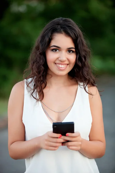 Attractive brunette girl with mobile — Stock Photo, Image