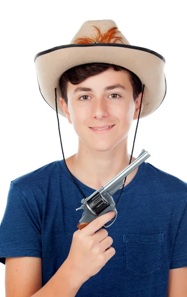 Tiener jongen met een cowboyhoed en een pistool — Stockfoto