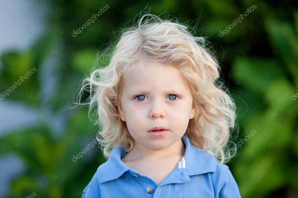 Beautiful Boy Three Year Old With Long Blond Hair Stock Photo