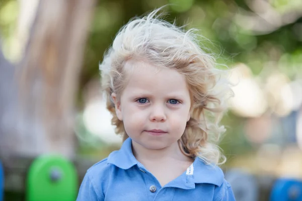 Beautiful boy three year old with long blond hair — Stock Photo, Image