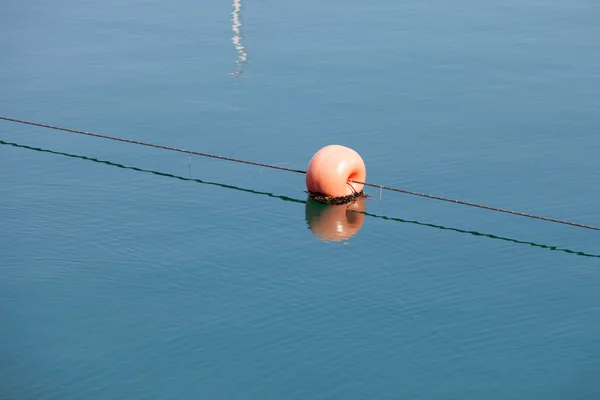 Red round buoy in the sea — Stock Photo, Image