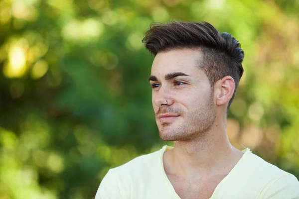 Attractive guy in the park — Stock Photo, Image