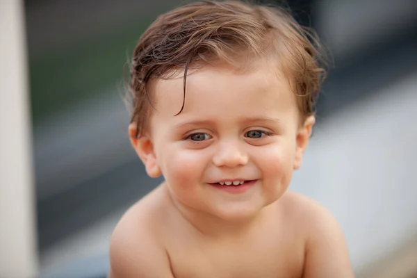 Beautiful baby outside with wet hair — Stock Photo, Image