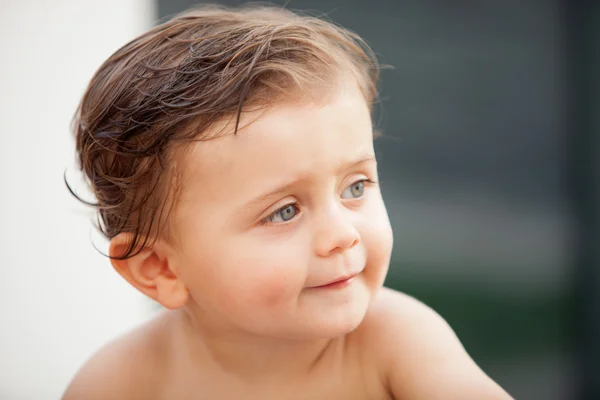 Beautiful baby outside with wet hair — Stock Photo, Image