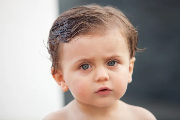 Beautiful baby outside with wet hair — Stock Photo, Image