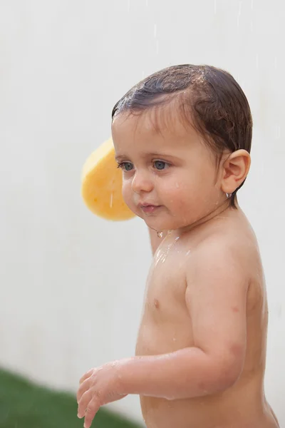 Funny kid showering in the yard — Stock Photo, Image