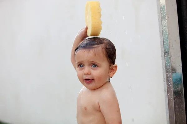 Funny kid showering in the yard — Stock Photo, Image