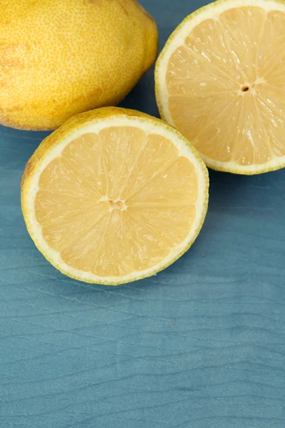 Lemons on a blue wood — Stock Photo, Image