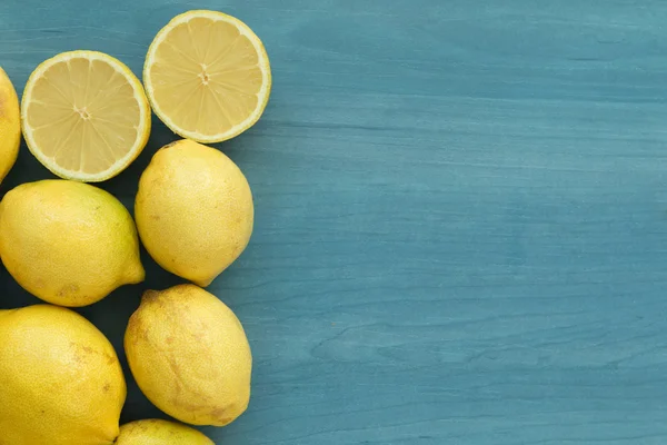 Lemons on a blue wood — Stock Photo, Image