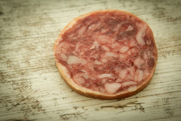 Slice sausage on a wooden board — Stock Photo, Image