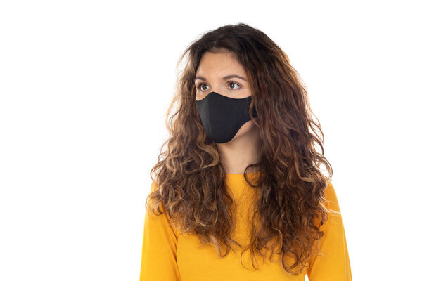 Beautiful woman wearing a black mask isolated on a white background