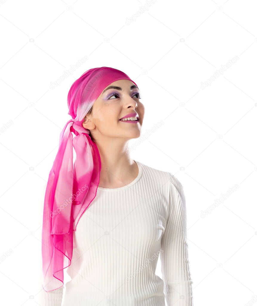 Young brunette woman wearing pink head scarf isolated on a white background