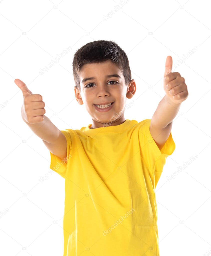 Adorable latin boy weraring a yellow t-shirt isolated on a white background