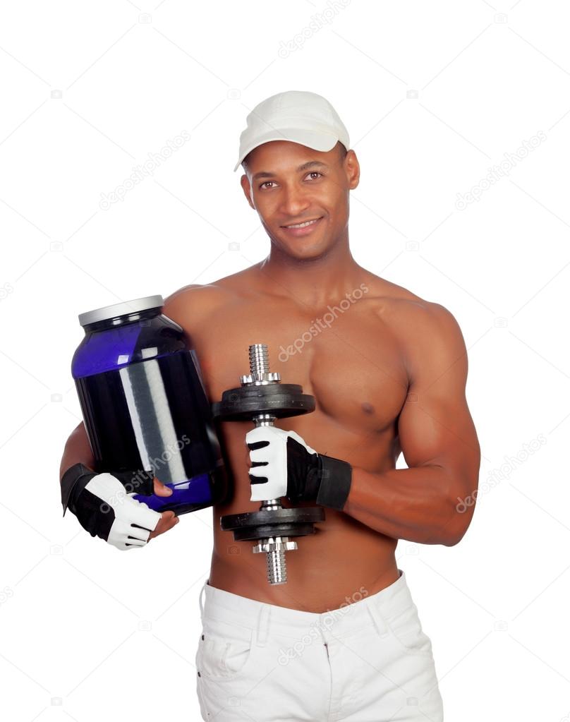Strong Latin American man with dumbbells drinking protein after 