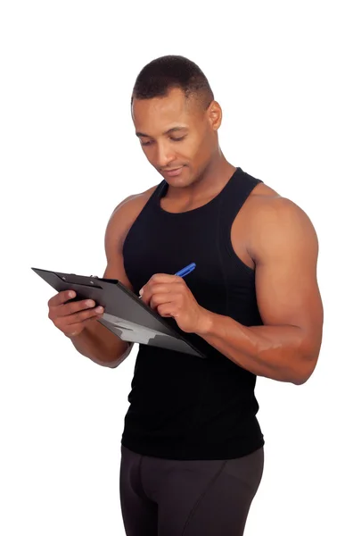 Handsome guy filling the form of the gym — Stock Photo, Image