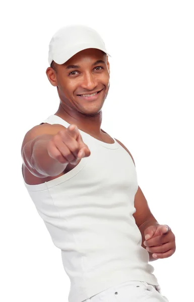 Pohledný chlap oblečený v bílém ukazuje na kameru s prstem — Stock fotografie