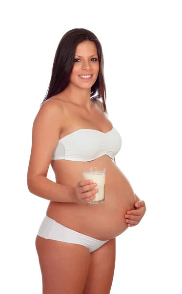 Morena grávida em roupa interior com leite de vidro — Fotografia de Stock