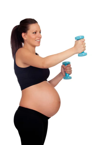 Morena mulher grávida treinando com halteres — Fotografia de Stock