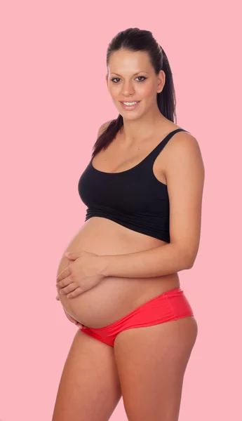 Brunett gravid kvinna i underkläder — Stockfoto