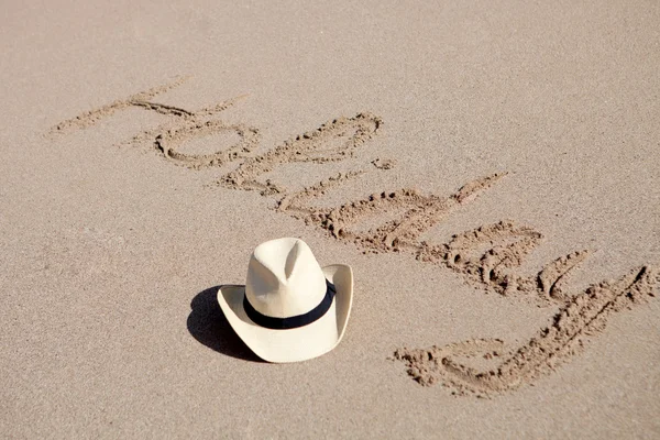 Written on the sand word Holiday — Stock Photo, Image