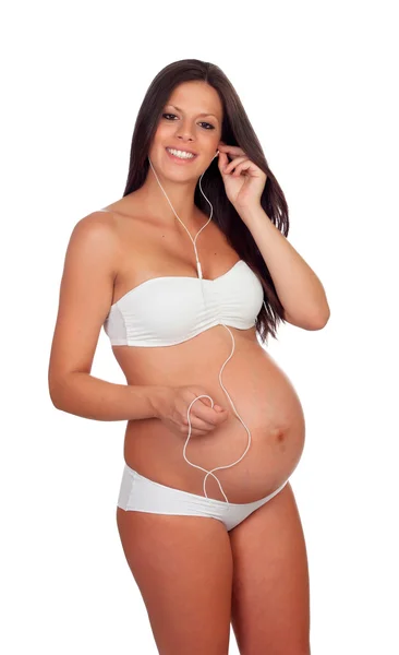 Hermosa embarazada escuchando música — Foto de Stock