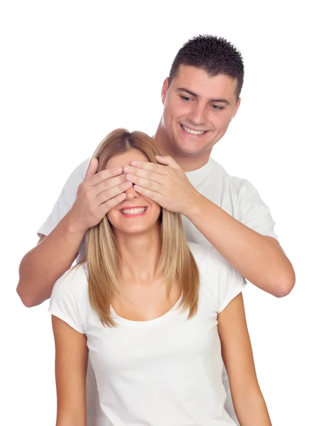 Boy covering his girlfriend's eyes Royalty Free Stock Photos