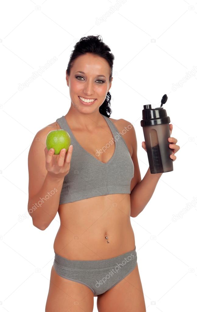 Woman after her training, drinking protein shake 