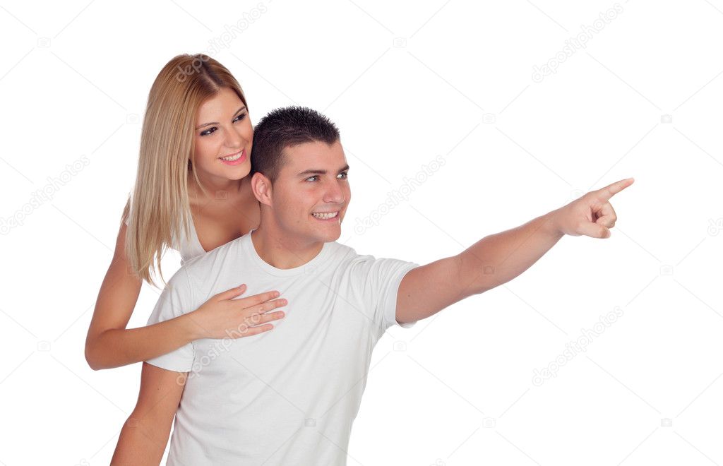 Young couple looking at where the guy is pointing