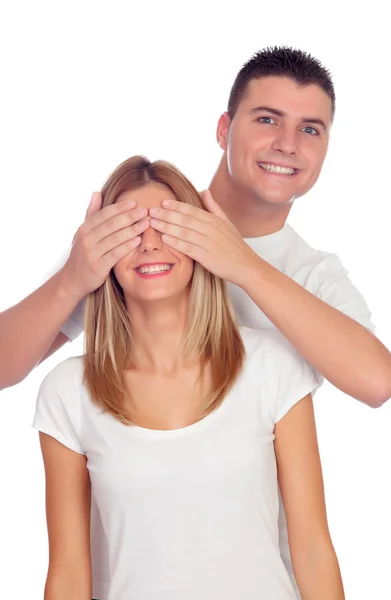 Sonriente niño cubriendo los ojos de su novia Imágenes de stock libres de derechos