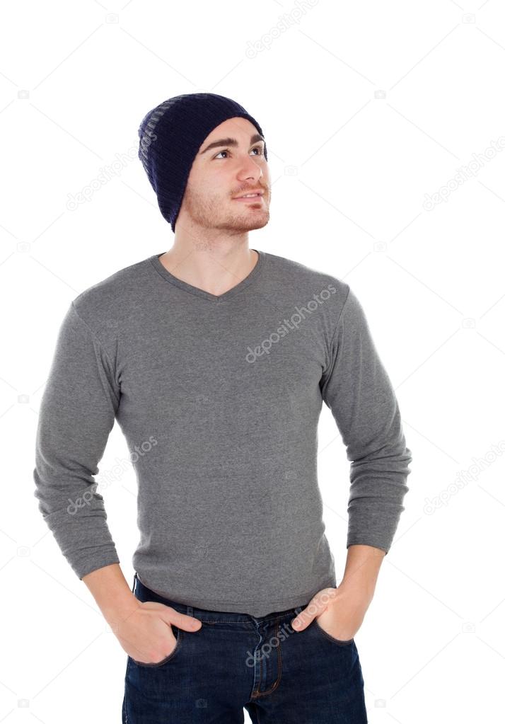 Muscled man with wool hat looking up