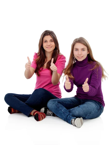 Two different sisters saying Ok — Stock Photo, Image