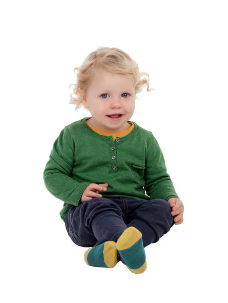 Adorable blond baby sitting on the floor — Stock Photo, Image