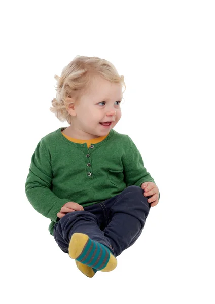 Adorable blond baby sitting on the floor — Stock Photo, Image