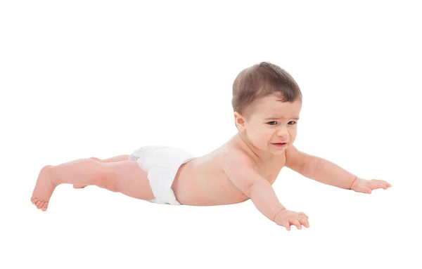 Sad six month baby in diaper lying on the floor — Stock Photo, Image