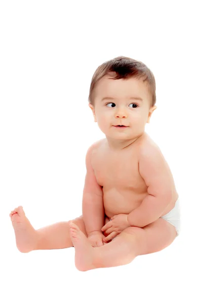 Adorable bebé de seis meses en pañal mirando hacia un lado — Foto de Stock