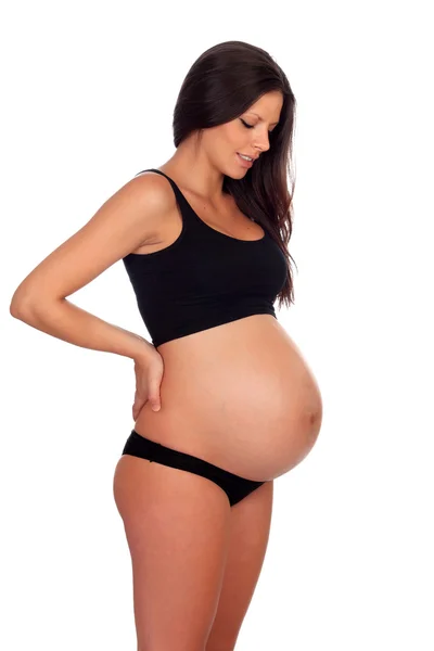 Lockande brunett gravid i underkläder med sin händer i den — Stockfoto