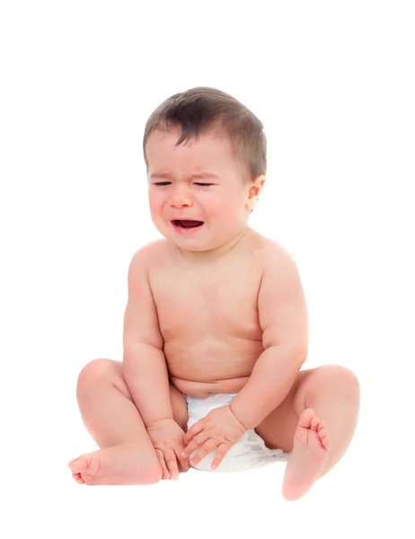 Милый ребенок в подгузнике плачет — стоковое фото