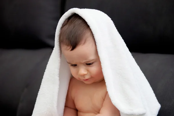 Adorable baby covered with a towel — Stock Photo, Image